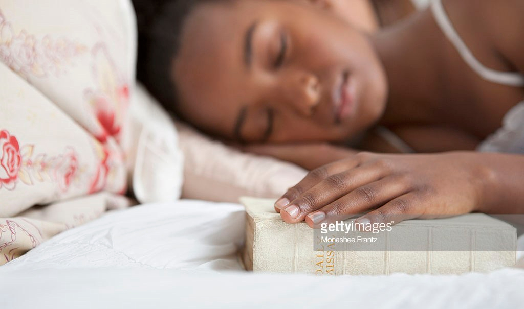 Girl sleep with bible
